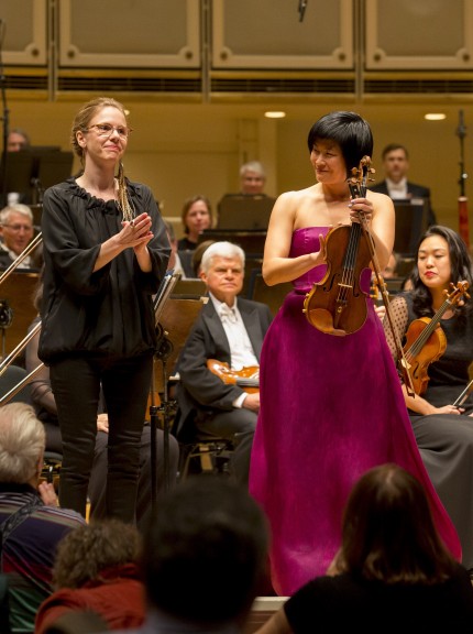 Composer Anna Clyne and violinist Jennifer Koh acknowledge applause after the CSO world premiere of Clyne's "The Seamstress" Thursday night. Photo: Todd Rosenberg