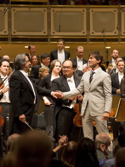 Riccardo Muti congratulates Mason Bates following the Chicago Symphony Orchestra's world premiere of Bates' "Anthology of Fantastic Zoology" Thursday night. Photo: Todd Rosenberg