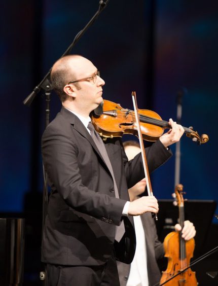David Bowlin performed Marcos Balter's Violin Concerto at the Ear Taxi Festival Thursday night at the Harris Theater.