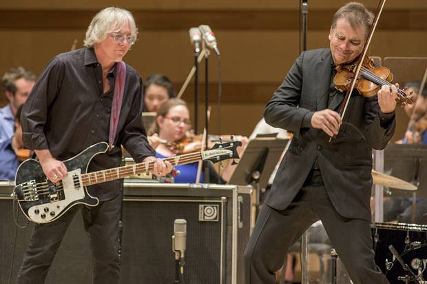Violinist Robert McDuffie and bass Mike Mills performed Mills’ Concerto for Violin, Rock Band and String Orchestra Monday night at the Harris Theater. File photo: Sacks & Co./ Alex Irvin